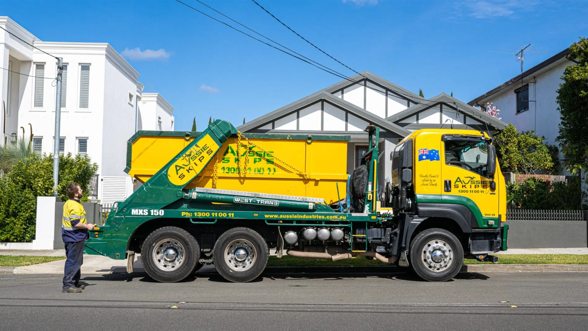 Skip bin truck serving a managed loading area